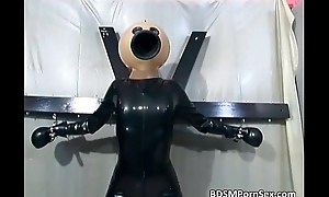 Censorious babe in latex suit and a mask