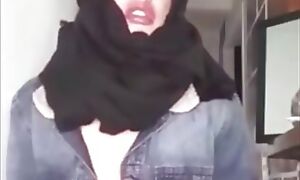 Arab wearing burqa and kneeling of her master