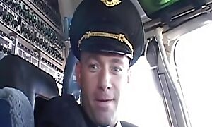 Randy pilot caresses low-spirited brunette yon burnish apply cockpit