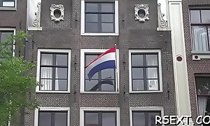 Excited guy gets outside and explores amsterdam redlight block