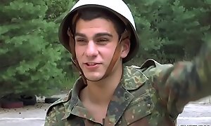 Young homosexual guys in uniform exchange blowjobs on the roadside