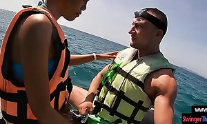 Oriental girlfriend gives a oral sex in public on a jetski